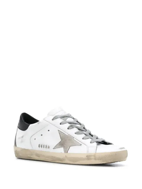 Golden Goose Super-Star trainers with black heel tab and metal stud lettering