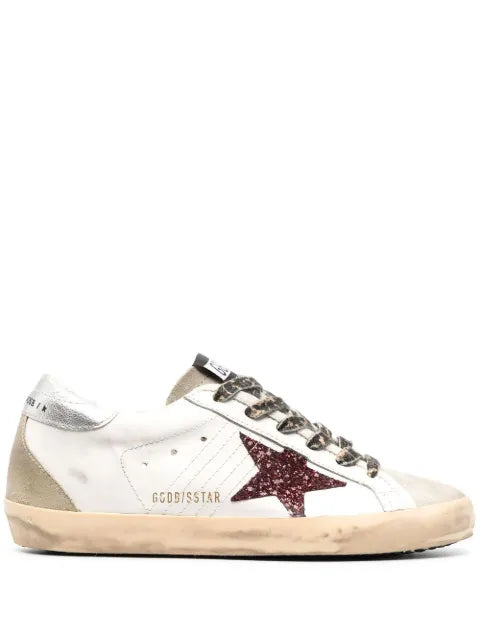 Golden Goose Super-Star trainers with burgundy glitter star and silver heels tab