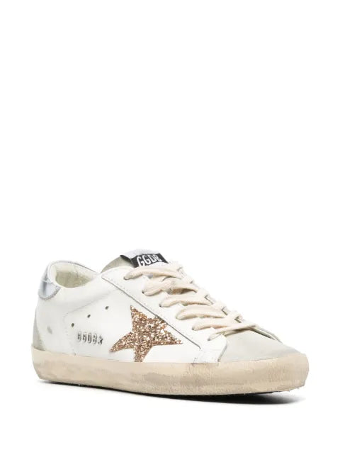 Golden Goose Super-Star trainers with gold glitter star and ice-gray suede inserts