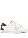 Golden Goose Super-Star trainers with gold star and black glitter heels tab