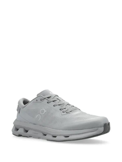 On logo-print trainers