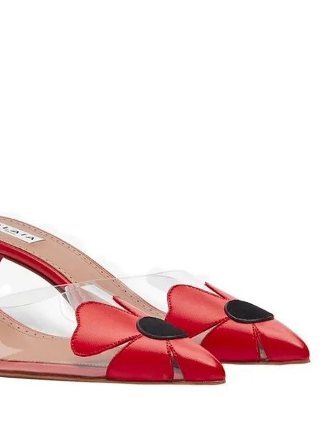 Alaïa bloom mules in calfskin