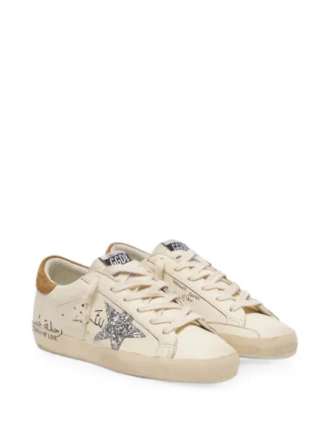 Golden Goose Super-Star in nappa with silver glitter star and all-over lettering sneakers